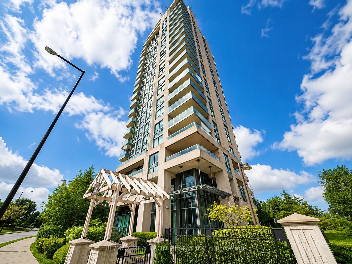 Skyscape tower at 68 Grangeway Avenue seen from the landscaped entrance walk